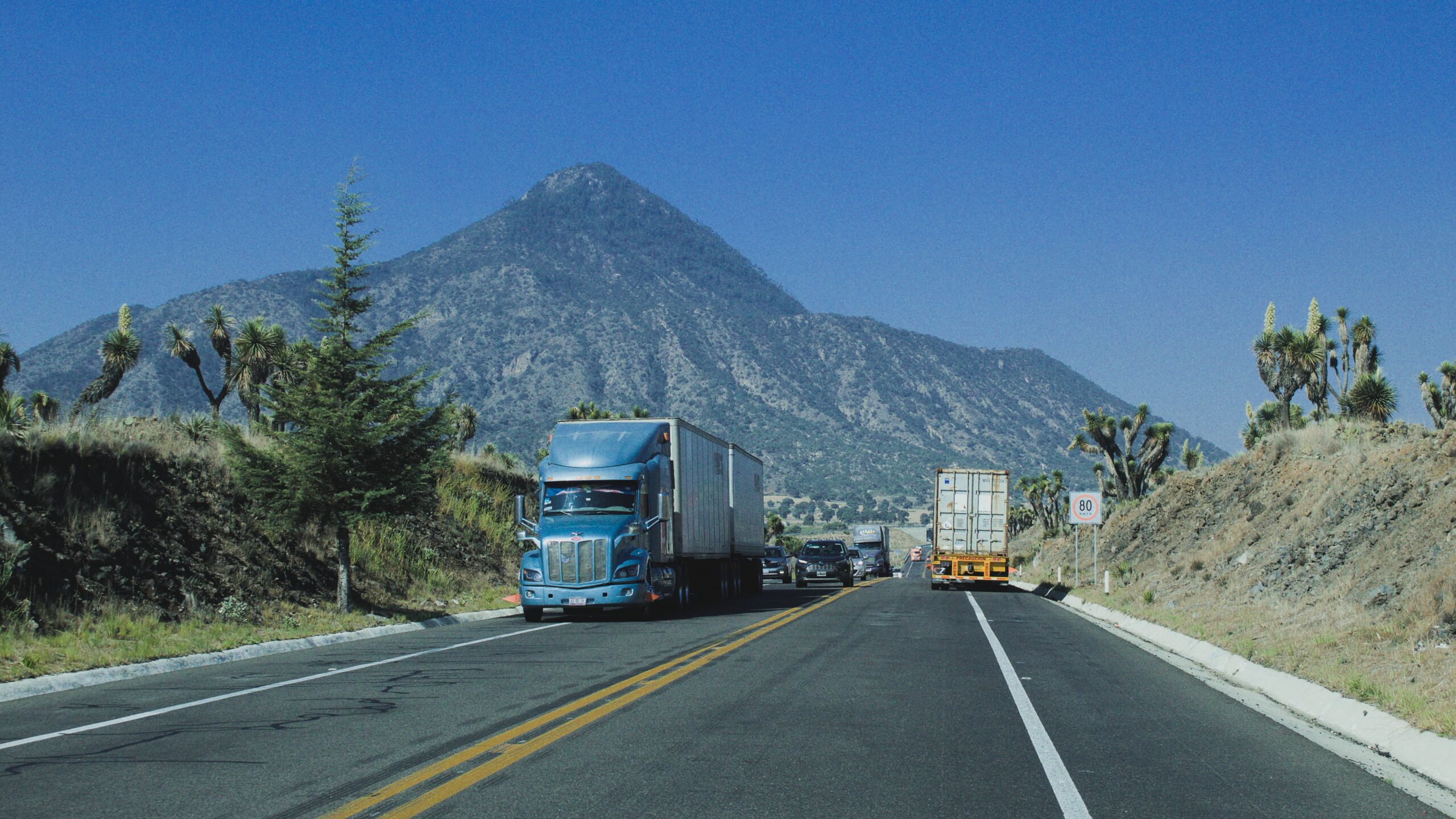 Trucks driving on a mountain highway
